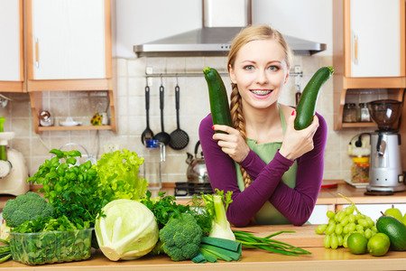 2 big cucumbers 1 very happy woman