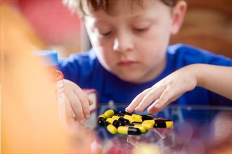 kid eating vitamin supplements